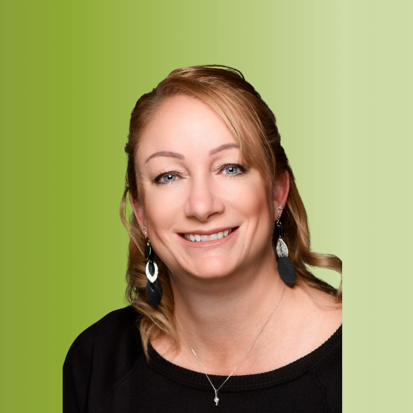Person wearing a black top with dangling earrings and a delicate necklace, against a green gradient background.