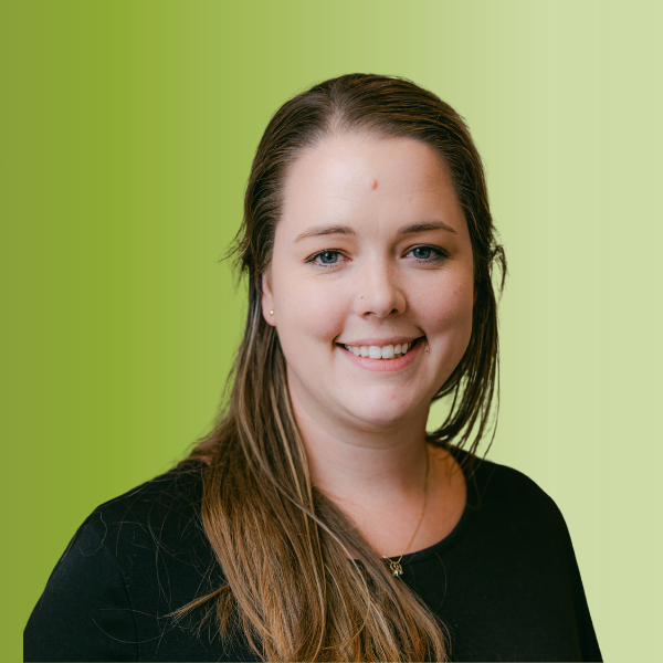 Person wearing a black top with long straight hair, against a green gradient background.