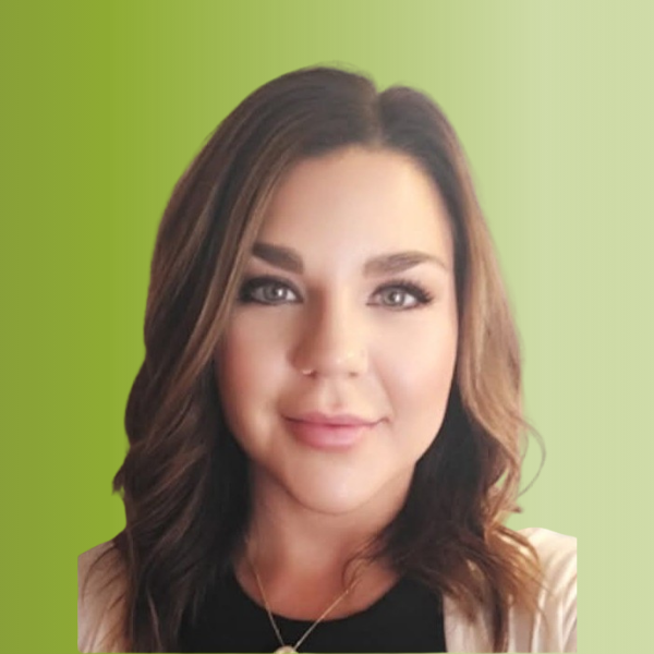 Person wearing a black top with a white cardigan and a long necklace, against a green gradient background.