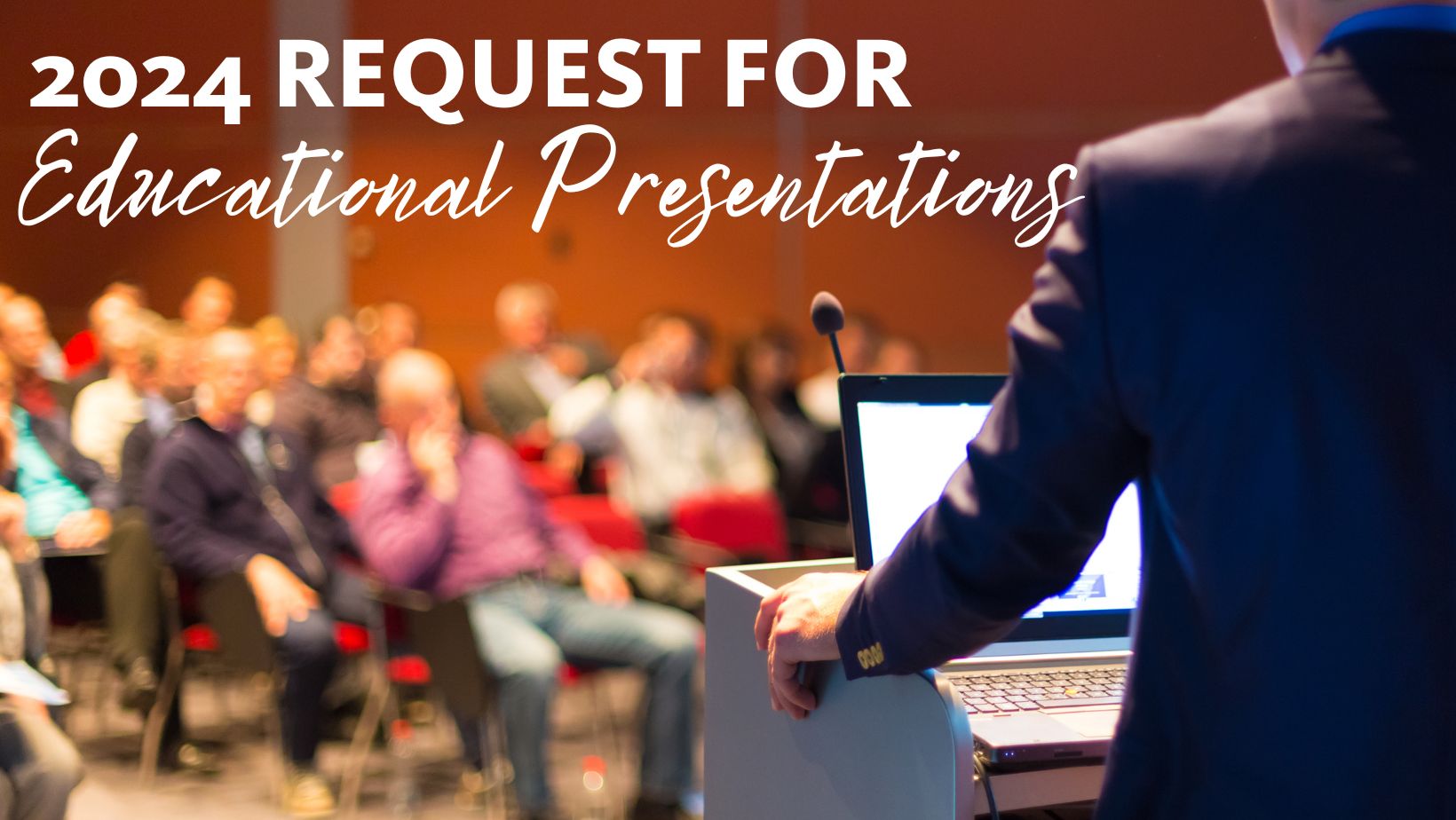 Person giving presentation to a crowded room. 2024 Request for Educational Presentations