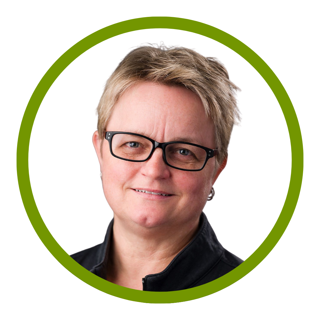 Headshot style image of a person with short, light brown hair inside a green circular border